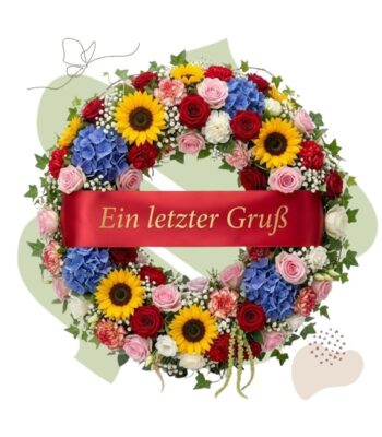 Bunter Trauerkranz mit roter Trauerschleife
